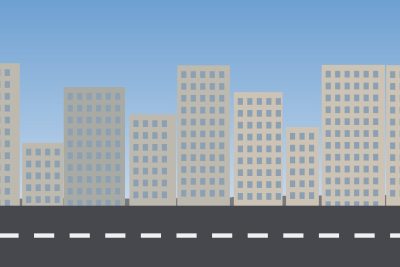 Rua com prédios baixos e faixa de pedestres