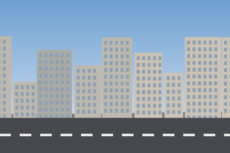 Rua com prédios baixos e faixa de pedestres